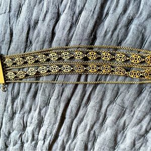 Multi layered gold tone metal bracelet by Lucky